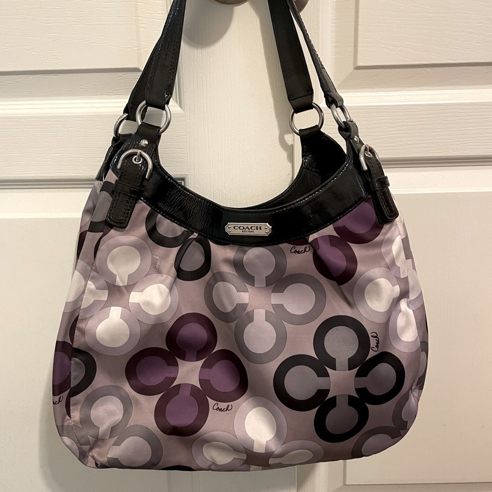Purple, grey, and black Coach purse